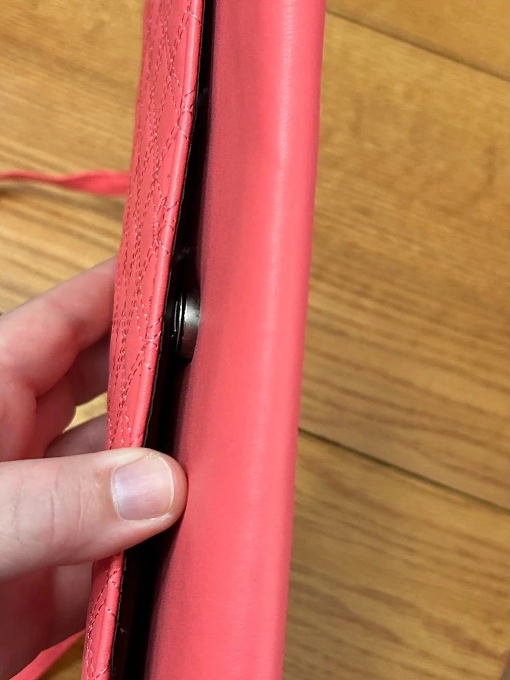 Pink wallet purse with shoulder strap and clasp